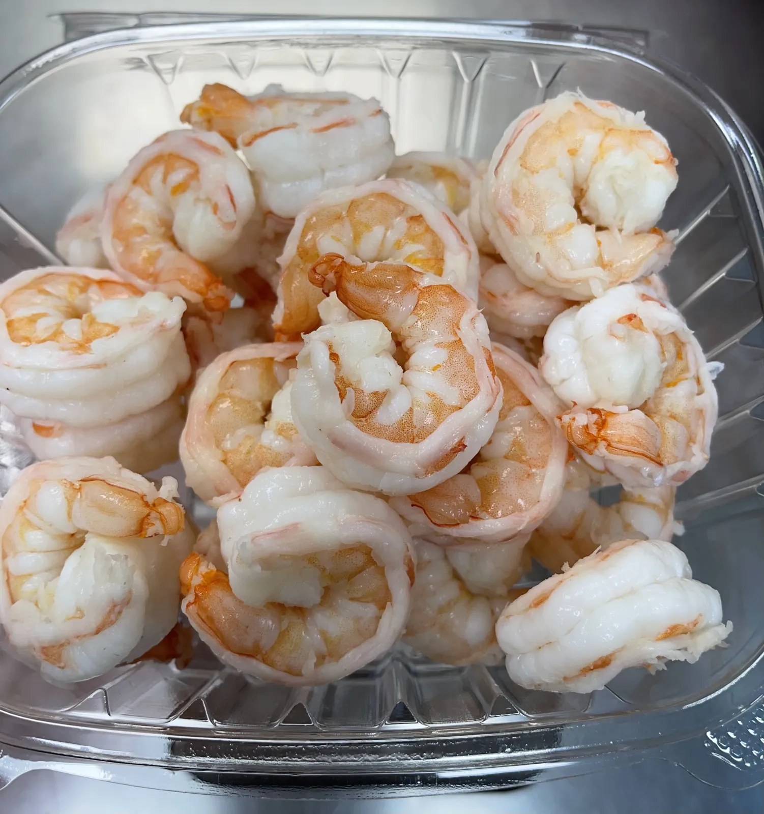 Cooked jumbo shrimp on a tray at Fountain View Fish Market in Houston