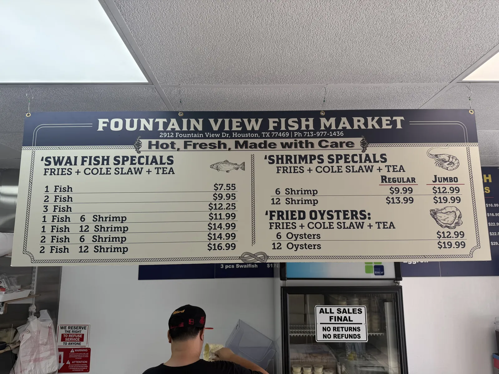 The menu board at Fountain View Fish Market in Houston