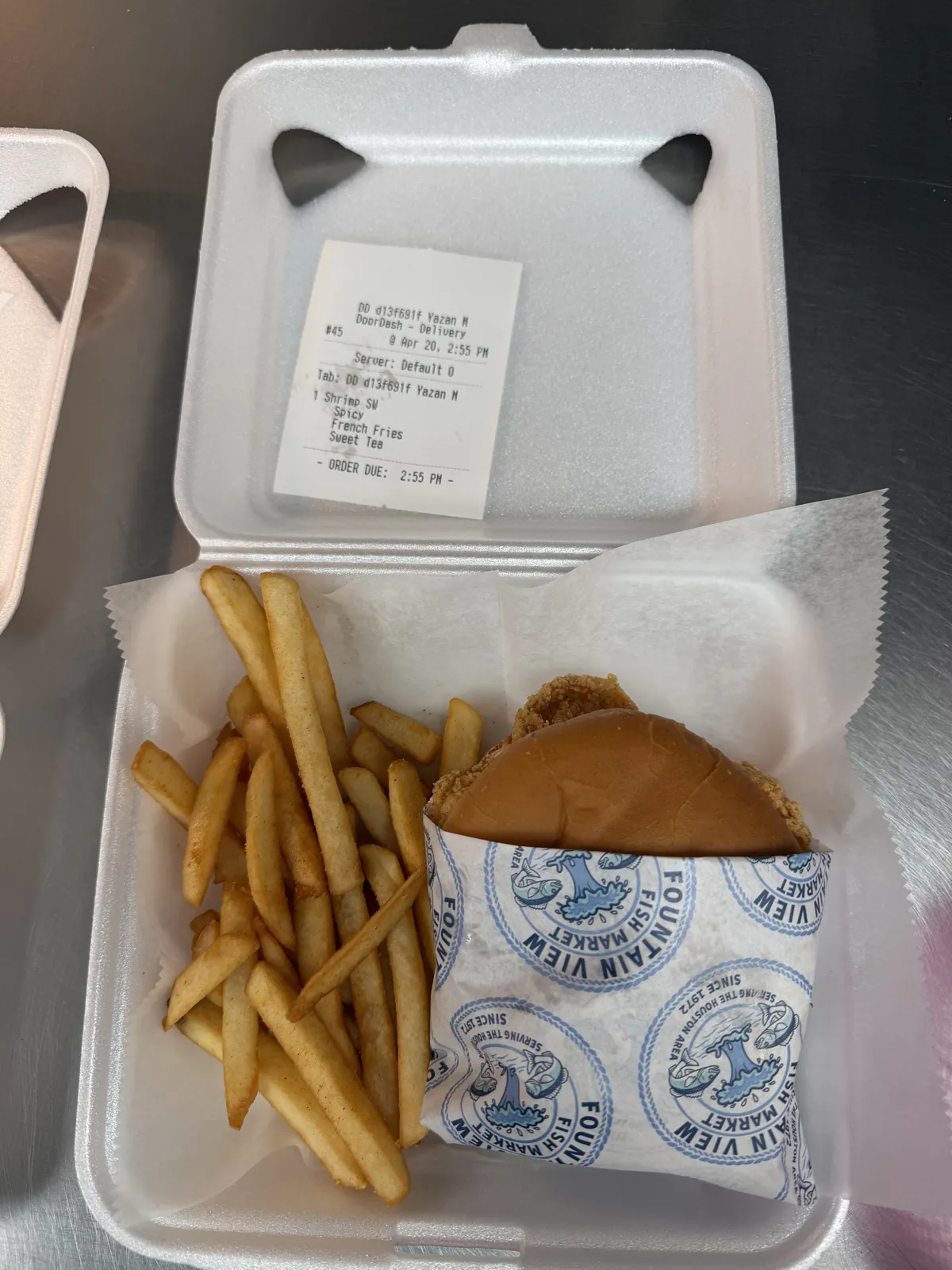 A fried fish plate to go, with fries and coleslaw, from Fountain View Fish Market in Houston