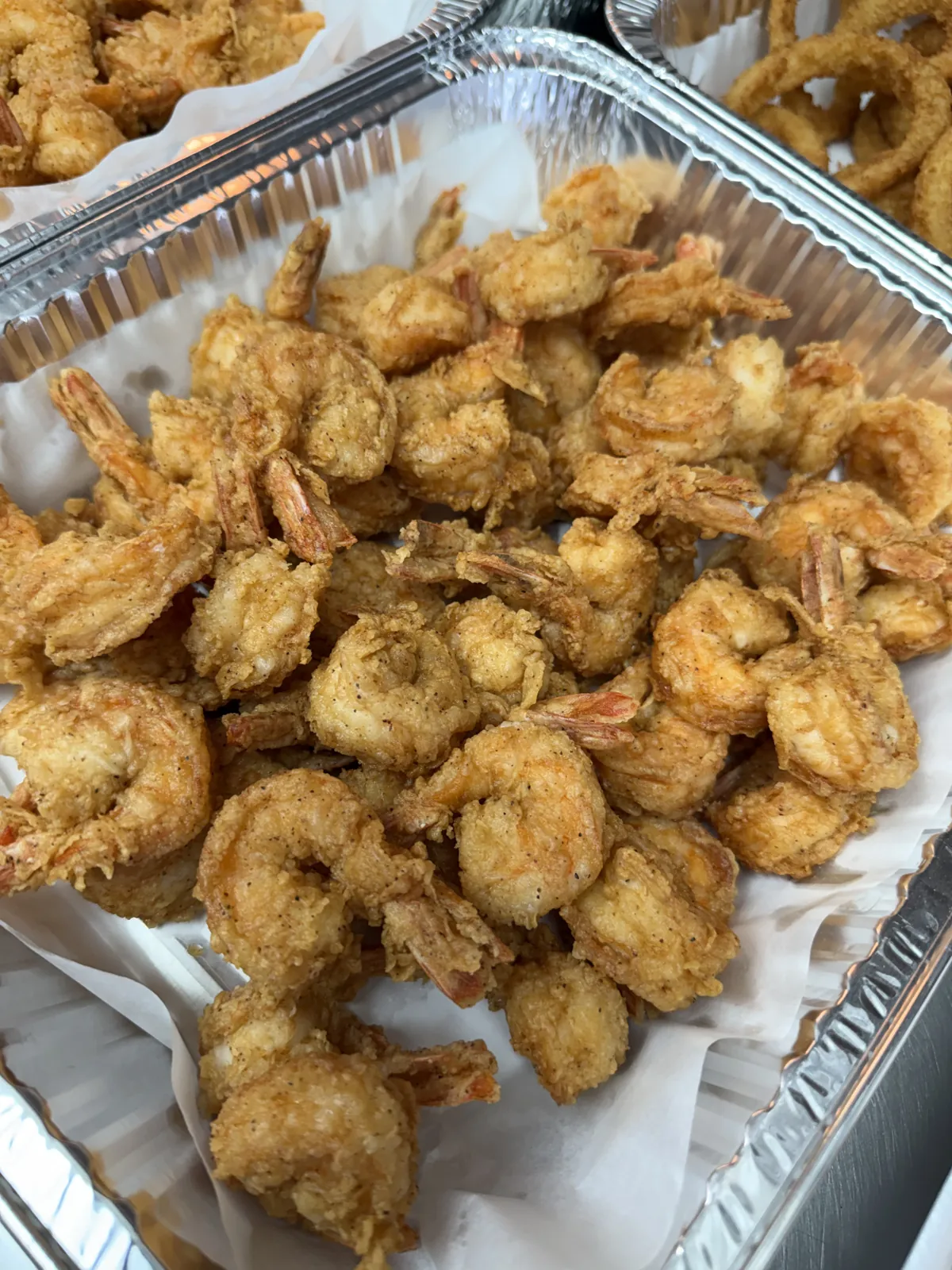 A tray of golden fried shrimp prepared at Fountain View Fish Market