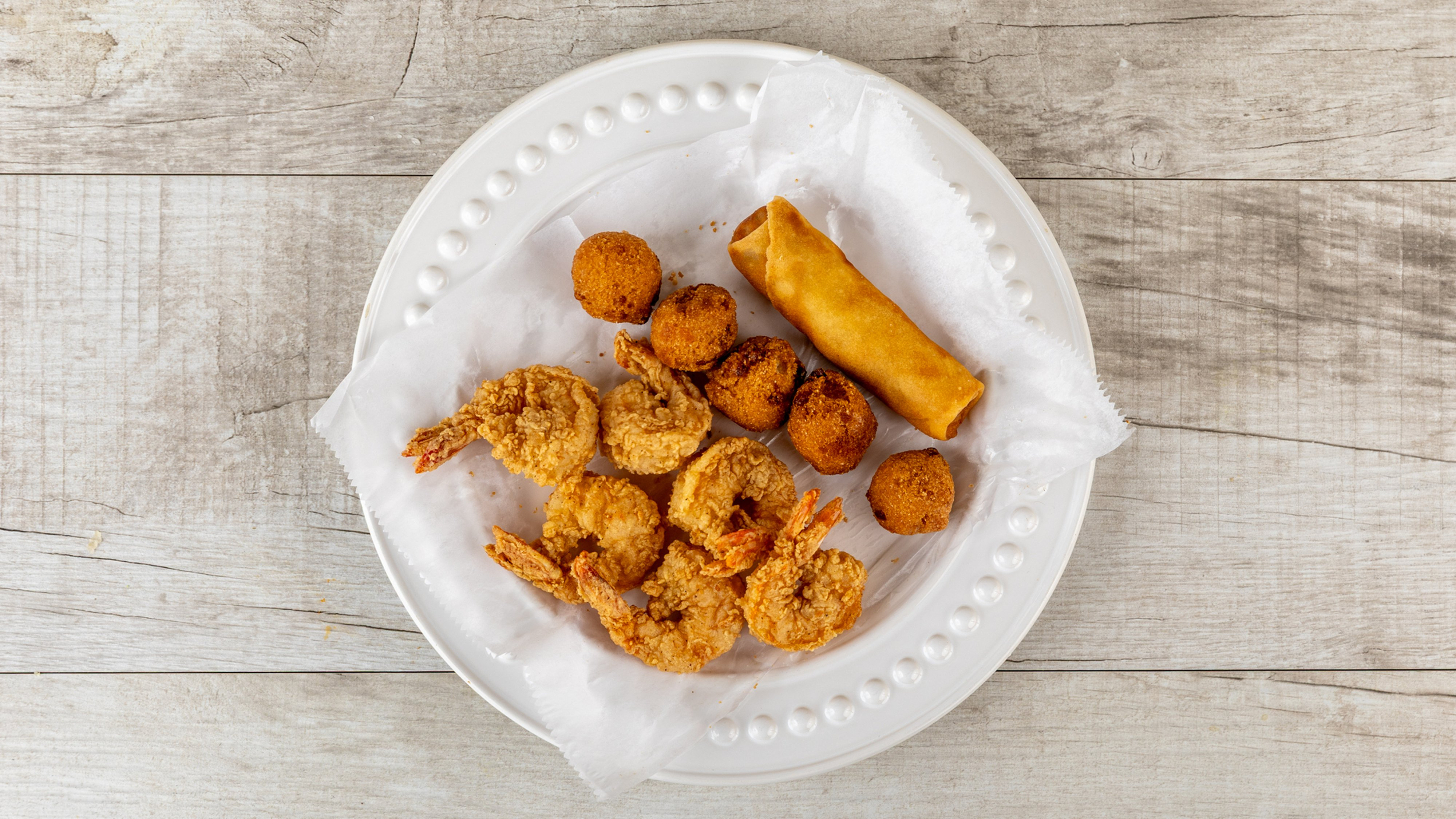 Jumbo Gulf shrimp with eggroll and hush puppies
