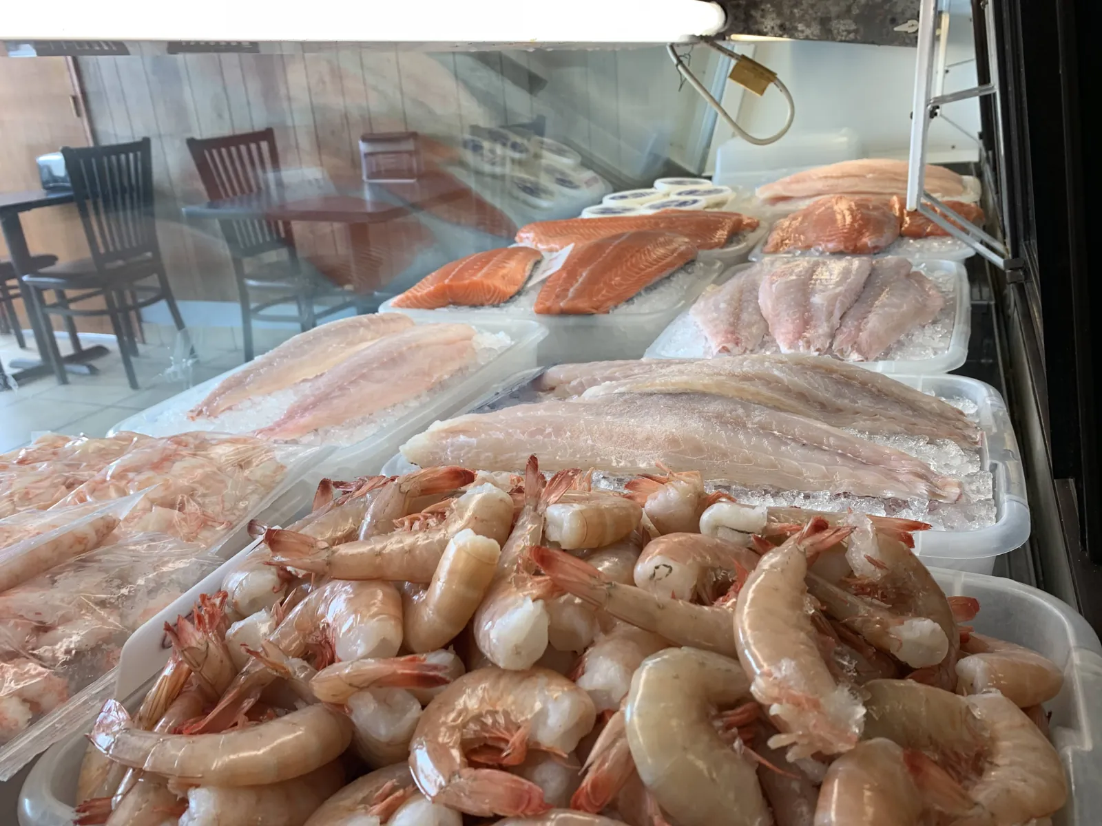 Raw Gulf shrimp on ice at the Fountain View Fish Market counter in Houston